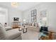 Comfortable living room with neutral furniture, hardwood floors, and plantation shutters at 201 Broad St., Georgetown, SC 29440