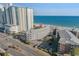 Aerial view of a condo complex near the beach with ocean views and a street in front of the building at 210 North Ocean Blvd. # 330, North Myrtle Beach, SC 29582