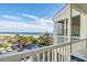 Relaxing balcony with chairs and table overlooks beautiful beach, ocean and parking at 210 North Ocean Blvd. # 330, North Myrtle Beach, SC 29582