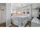 Cozy bedroom featuring a queen bed, white curtains, and wood-look floors at 210 North Ocean Blvd. # 330, North Myrtle Beach, SC 29582