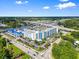 Aerial view of the complex, waterway, and surrounding area on a bright day at 2100 Sea Mountain Hwy. # 122, North Myrtle Beach, SC 29582