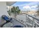 Picturesque harbor view from the balcony, complete with seating and lush palm trees at 2100 Sea Mountain Hwy. # 122, North Myrtle Beach, SC 29582