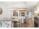 Open dining area with a modern light fixture and view into the kitchen at 2100 Sea Mountain Hwy. # 122, North Myrtle Beach, SC 29582