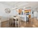 View of the dining area with an elegant light fixture and a view into the kitchen space at 2100 Sea Mountain Hwy. # 122, North Myrtle Beach, SC 29582