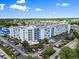 Beautiful exterior view of the condominium complex with ample parking and lush landscaping at 2100 Sea Mountain Hwy. # 122, North Myrtle Beach, SC 29582