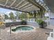 Community hot tub featuring a wooden pergola, brick patio, and lush tropical foliage at 2100 Sea Mountain Hwy. # 122, North Myrtle Beach, SC 29582