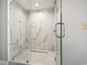 Modern glass shower with white marble tiles and contemporary fixtures at 2100 Sea Mountain Hwy. # 122, North Myrtle Beach, SC 29582