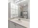 Well-lit bathroom vanity with white cabinets and ample counter space at 218 Landing Rd. # G, North Myrtle Beach, SC 29582