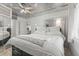 Light-filled bedroom featuring a stylish tin ceiling, ceiling fan and neutral decor at 218 Landing Rd. # G, North Myrtle Beach, SC 29582