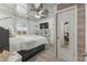 Bright bedroom with decorative tin ceiling, TV, and stylish built-in shelving at 218 Landing Rd. # G, North Myrtle Beach, SC 29582