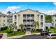 Beautiful condominium with multiple stories, exterior balconies, palm trees, and waterfront views at 218 Landing Rd. # G, North Myrtle Beach, SC 29582