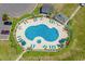 Aerial view of the pool area featuring lounge chairs, tables, and well-maintained landscaping at 218 Landing Rd. # G, North Myrtle Beach, SC 29582