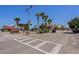 Street view of shops, restaurants, palm trees and parking in a beach community at 218 Landing Rd. # G, North Myrtle Beach, SC 29582