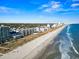 Coastal aerial view of a beachfront condominium complex with sandy shores meeting the beautiful ocean at 2241 Waterview Dr. # 527, North Myrtle Beach, SC 29582