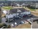 The aerial view shows the beautiful townhome complex with an outdoor pool and manicured lawns at 2241 Waterview Dr. # 527, North Myrtle Beach, SC 29582