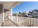 View from the balcony shows a neighborhood street with well-maintained homes and landscaping at 227 Walnut Grove Ct., Myrtle Beach, SC 29579