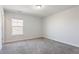 Neutral bedroom with carpet and a window looking out onto a brick building at 227 Walnut Grove Ct., Myrtle Beach, SC 29579