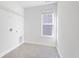 Well-lit laundry room with tile flooring, window, and washer hookups at 227 Walnut Grove Ct., Myrtle Beach, SC 29579