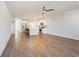 Open-concept living room with hardwood floors seamlessly flowing into a modern kitchen area at 227 Walnut Grove Ct., Myrtle Beach, SC 29579