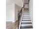 View of the staircase featuring dark hardwood steps and white risers at 227 Walnut Grove Ct., Myrtle Beach, SC 29579