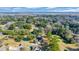 An aerial view of a brick home with mature landscaping, a golf course, and a river in the background at 268 Wraggs Ferry Rd., Georgetown, SC 29440