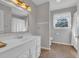 Bathroom featuring a single sink vanity, and a window providing natural light at 268 Wraggs Ferry Rd., Georgetown, SC 29440