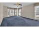 Spacious bedroom with a cozy blue carpet and a bay window for natural light at 268 Wraggs Ferry Rd., Georgetown, SC 29440