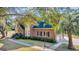 Brick home featuring a two-car garage and palm tree at 268 Wraggs Ferry Rd., Georgetown, SC 29440