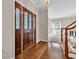 Inviting foyer with beautiful hardwood floors and a decorative wood front door at 268 Wraggs Ferry Rd., Georgetown, SC 29440