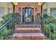 Close up of the entrance to a brick home with well-maintained landscaping at 268 Wraggs Ferry Rd., Georgetown, SC 29440