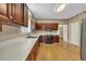 Traditional kitchen features wood cabinets, white countertops, and wood floors at 268 Wraggs Ferry Rd., Georgetown, SC 29440