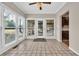 Bright sun room with tile flooring, large windows, and backyard views at 268 Wraggs Ferry Rd., Georgetown, SC 29440