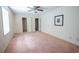 Bedroom featuring closet, bathroom, and overhead fan at 300 19Th Ave. S, Myrtle Beach, SC 29577