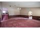 Expansive living area featuring neutral walls, wood trim and pink carpet at 300 19Th Ave. S, Myrtle Beach, SC 29577