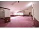 Expansive living area featuring neutral walls, wood trim and pink carpet at 300 19Th Ave. S, Myrtle Beach, SC 29577