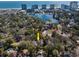 Aerial view of the property, showcasing its location and surrounding landscape of lake and buildings at 304 Queens Rd., Myrtle Beach, SC 29572