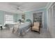 Bright bedroom with matching twin beds, a ceiling fan, and natural light from the window at 304 Queens Rd., Myrtle Beach, SC 29572