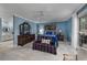 Spacious bedroom with a four-poster bed, a dresser, and a ceiling fan for added comfort at 304 Queens Rd., Myrtle Beach, SC 29572