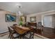 Inviting dining room with hardwood floors, chandelier, and elegant furnishings at 304 Queens Rd., Myrtle Beach, SC 29572