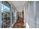 Bright hallway featuring hardwood floors, a large glass window, and white closet doors for ample storage space at 304 Queens Rd., Myrtle Beach, SC 29572