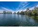 Scenic lake view showcasing the waterfront location with buildings and the distant waterfront skyline at 304 Queens Rd., Myrtle Beach, SC 29572