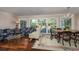 Bright and airy living room featuring hardwood floors, large windows, and stylish furnishings at 304 Queens Rd., Myrtle Beach, SC 29572