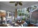 Relaxing screened porch featuring comfortable seating and a peaceful view of the surrounding landscape at 304 Queens Rd., Myrtle Beach, SC 29572