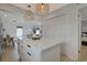 Kitchen island features countertop seating and flows to living spaces at 306 Oak Lake Circle, North Myrtle Beach, SC 29582