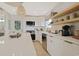 Bright kitchen with white countertops, pendant lighting, and stainless steel appliances at 306 Oak Lake Circle, North Myrtle Beach, SC 29582