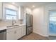 Bright kitchen featuring white cabinetry, stainless steel appliances, and a backyard view at 314 58Th Ave. N, North Myrtle Beach, SC 29582