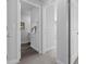 Hallway with framed art and bathroom access featuring wood flooring and a carpeted hallway at 315 Sandridgebury Dr. # 70, Little River, SC 29566