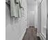 Bright hallway featuring wood floors and a framed picture with easy access to the shower at 315 Sandridgebury Dr. # 70, Little River, SC 29566