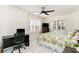 Bright bedroom with a ceiling fan, a floral comforter, and natural light from the shuttered windows at 323 45Th Ave. N, North Myrtle Beach, SC 29582