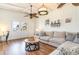 Cozy living room features wood-look floors, bright white walls, and a comfortable sofa at 323 45Th Ave. N, North Myrtle Beach, SC 29582